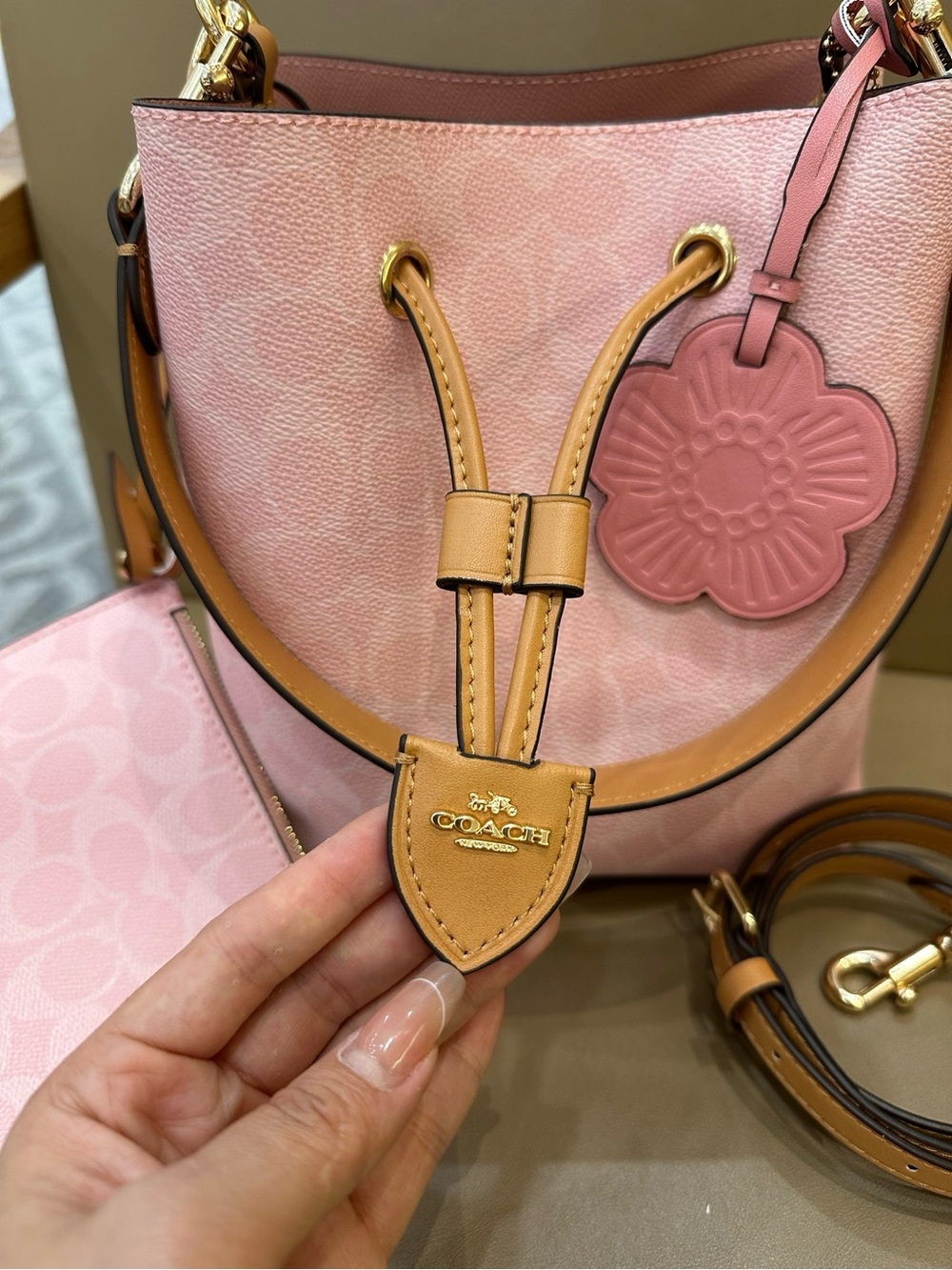 Coach Pink Pebble Leather Drawstring Bucket Bag with Tan Trim and Floral Charm - Picture 6 of 9